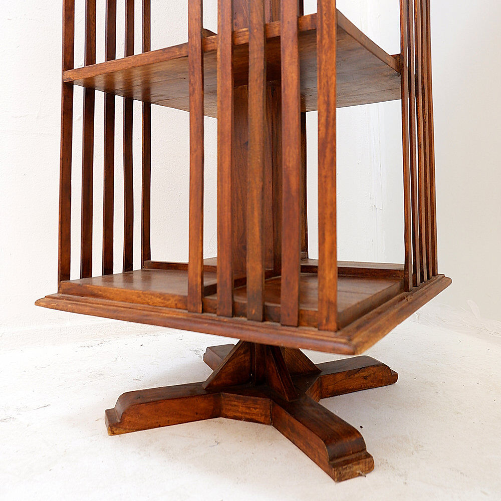 Rotating library on three levels with a central cruciform base.