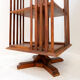 Rotating library on three levels with a central cruciform base.