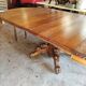 Oval oak table with carved details - known as a hunting table.