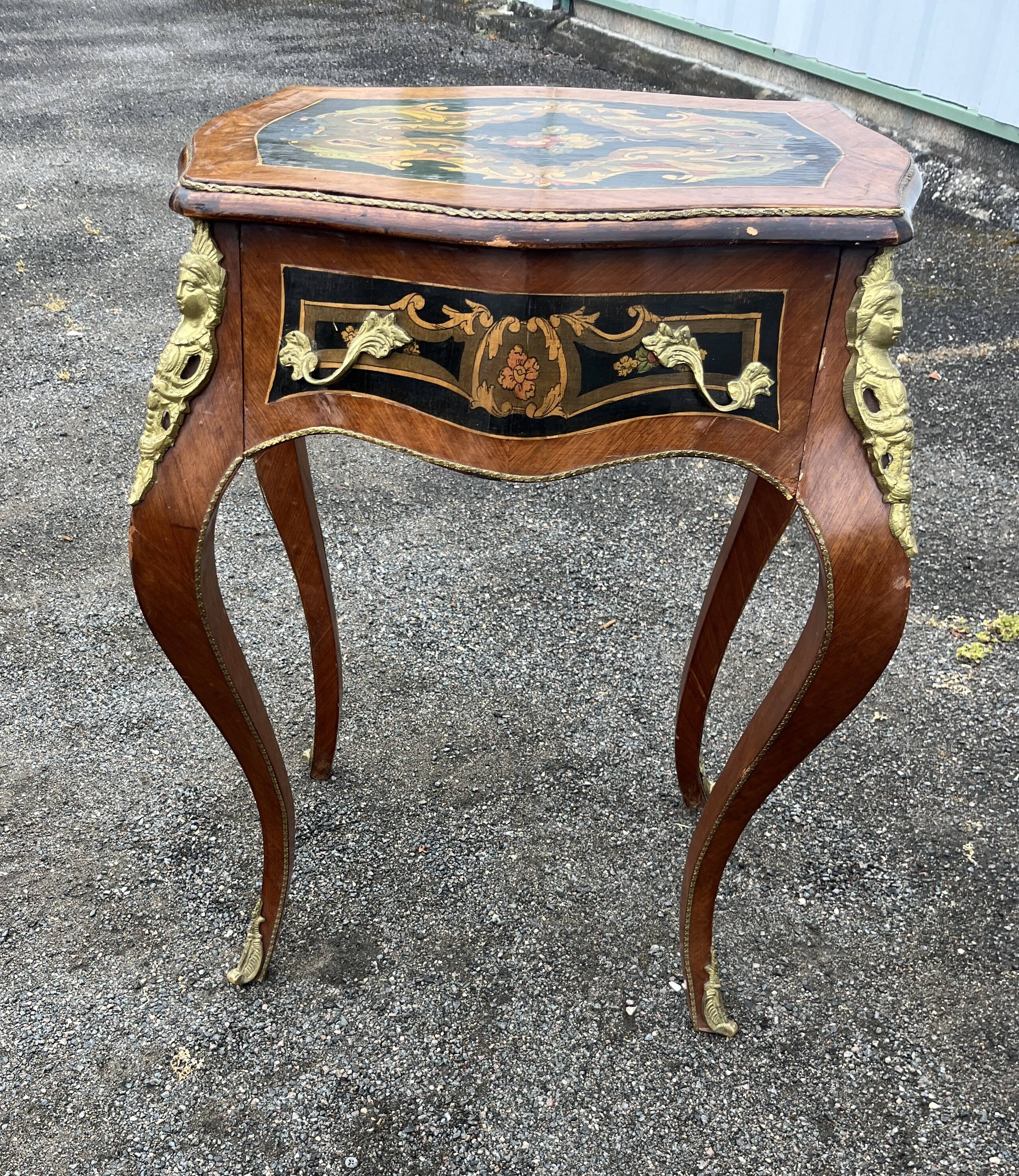 Louis XV style side table with marquetry and gilded bronze.