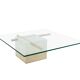 Coffee table with travertine gold-plated cross base and glass top
