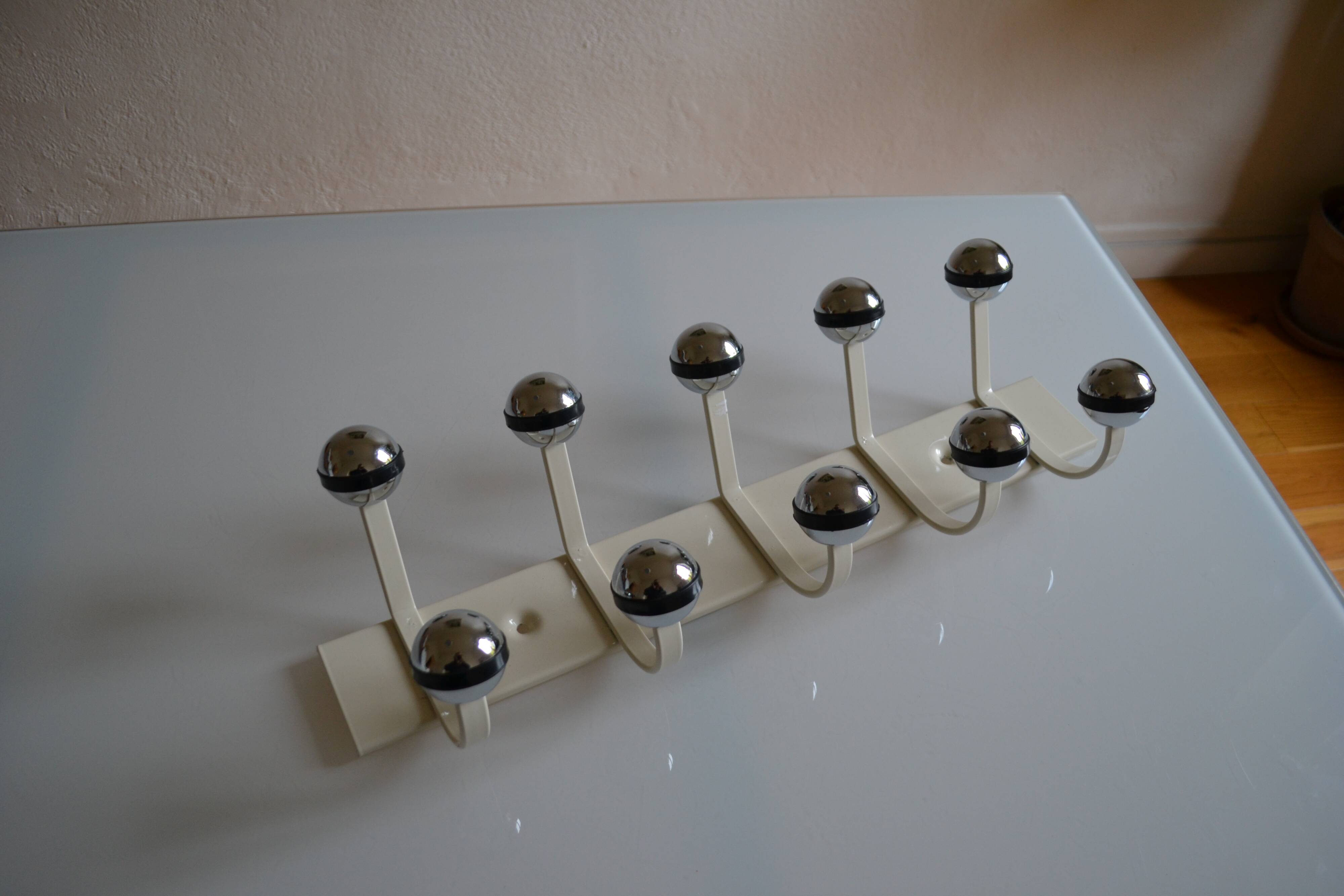 Vintage 1970s wall-mounted coat rack with 10 hooks