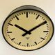Grey industrial factory wall clock from pragotron, 1960s