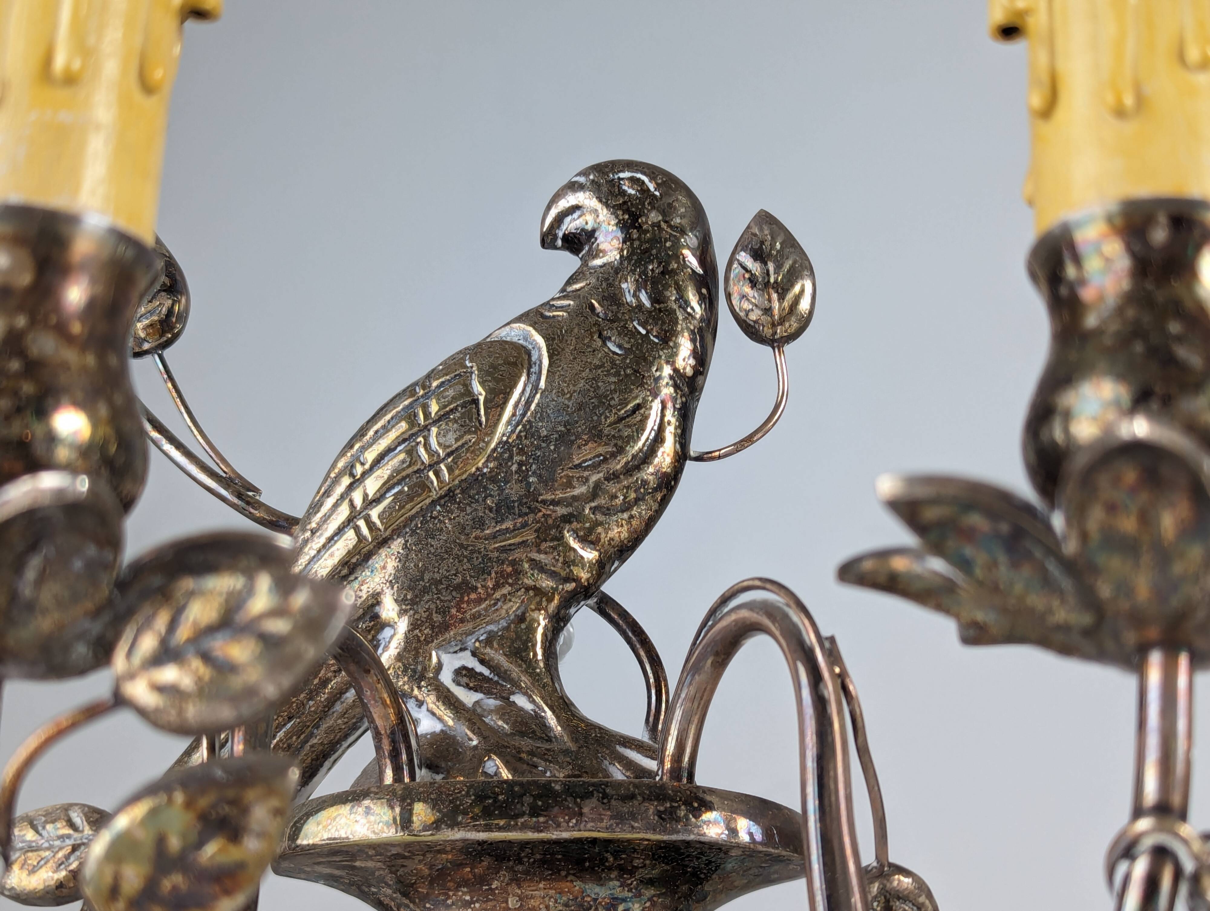 Pair of wall sconces with parrots and leaves