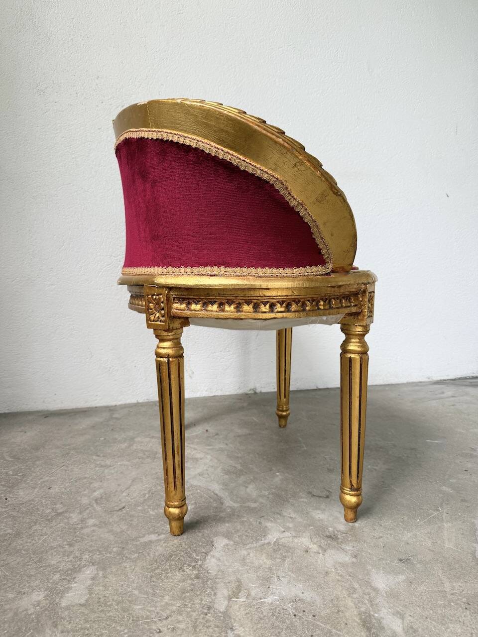 Louis XVI gilt wood and red velvet armchair