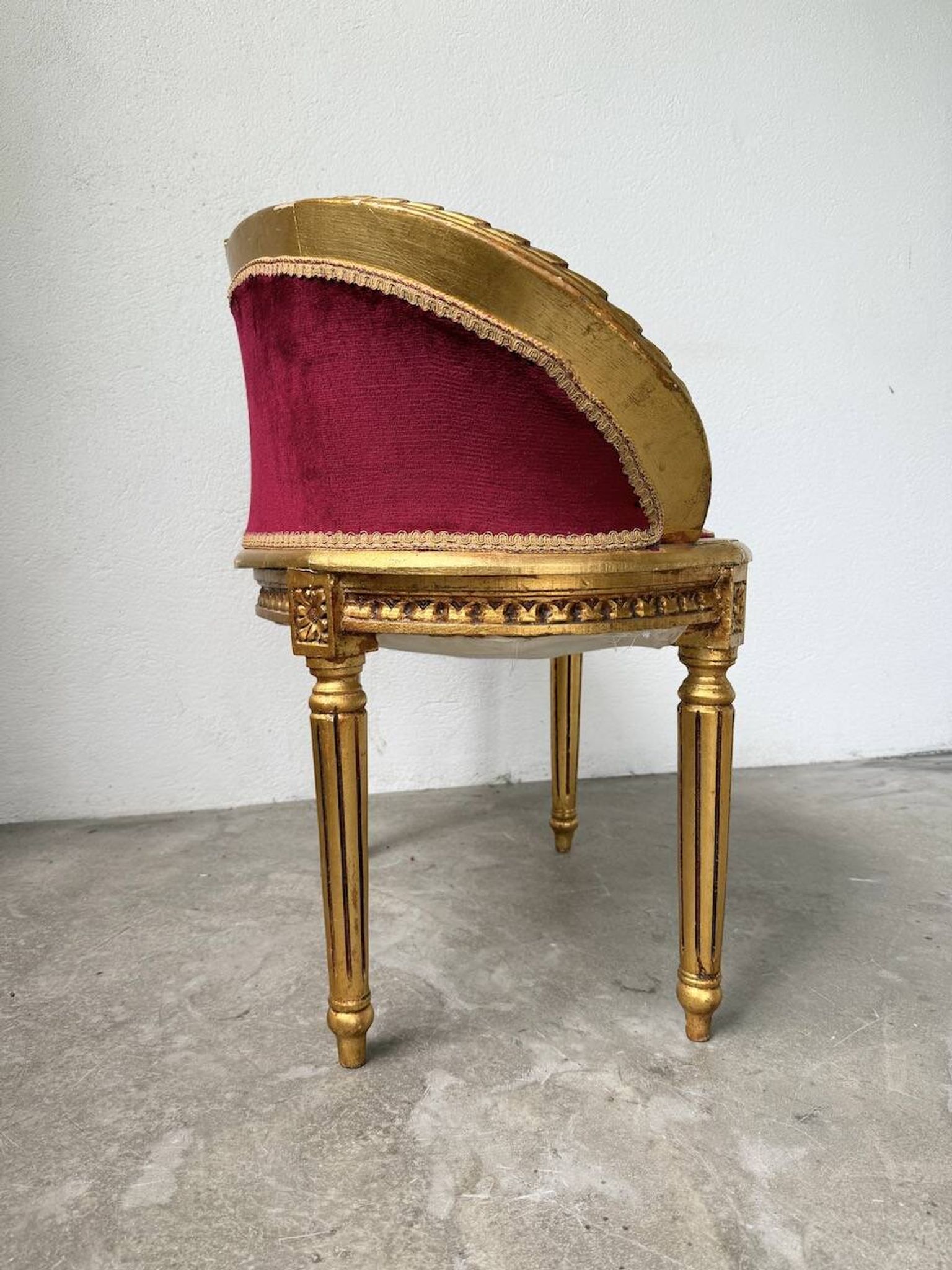Louis XVI gilt wood and red velvet armchair