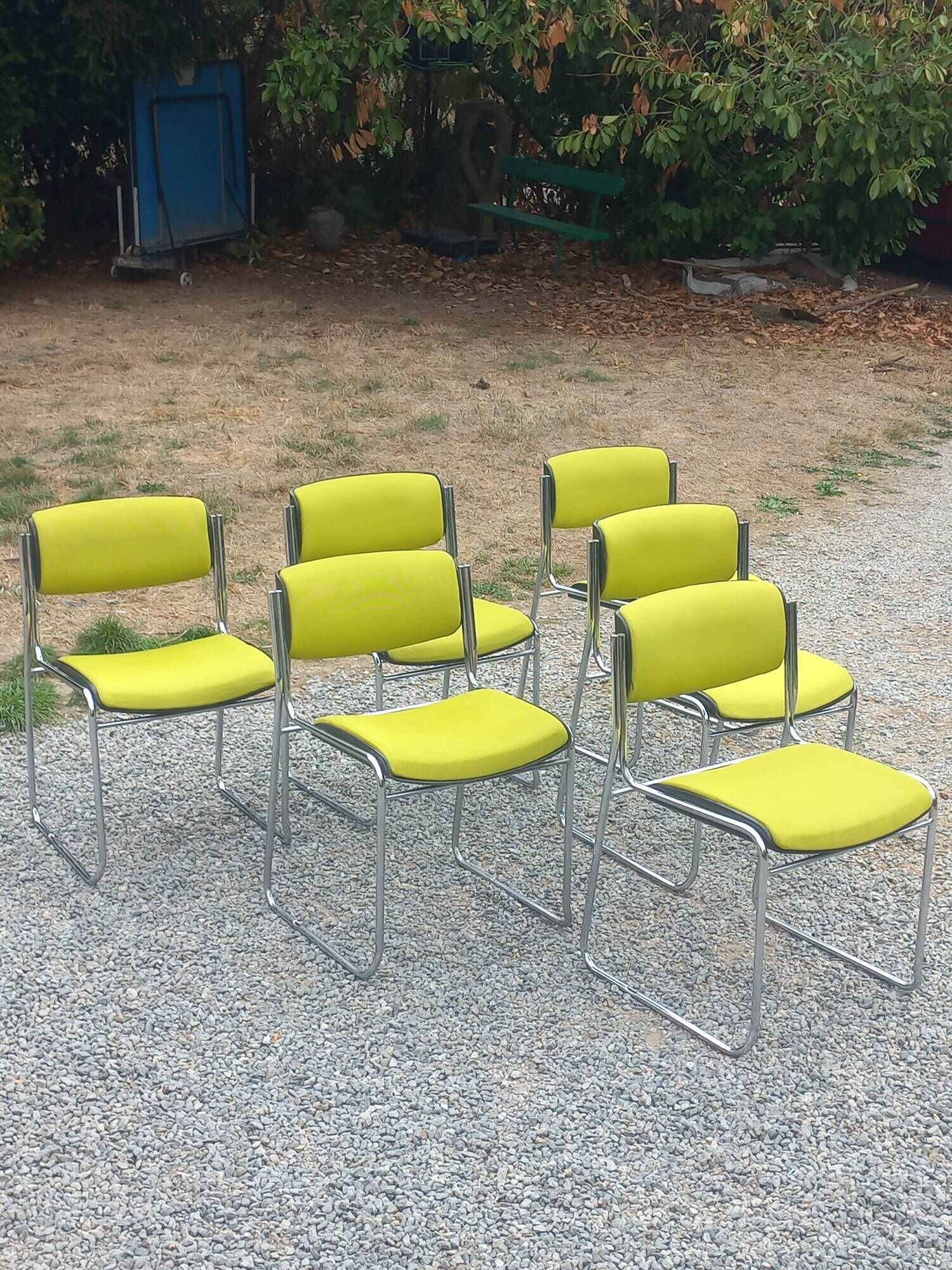 Set of 6 designer chairs with wooden seats and backs, chrome legs.