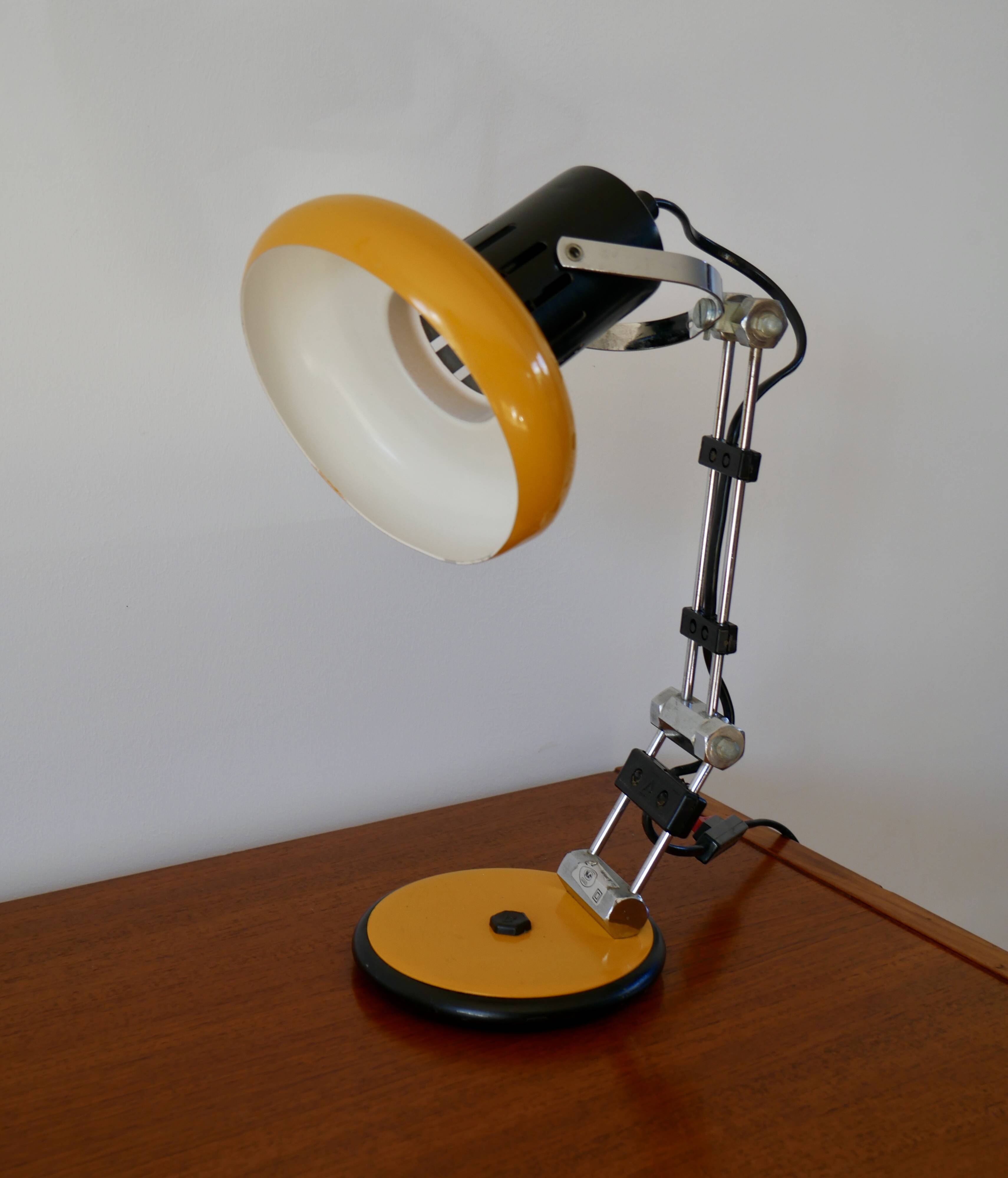 Articulated orange Aluminor desk lamp industrial design 70s