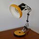 Articulated orange Aluminor desk lamp industrial design 70s
