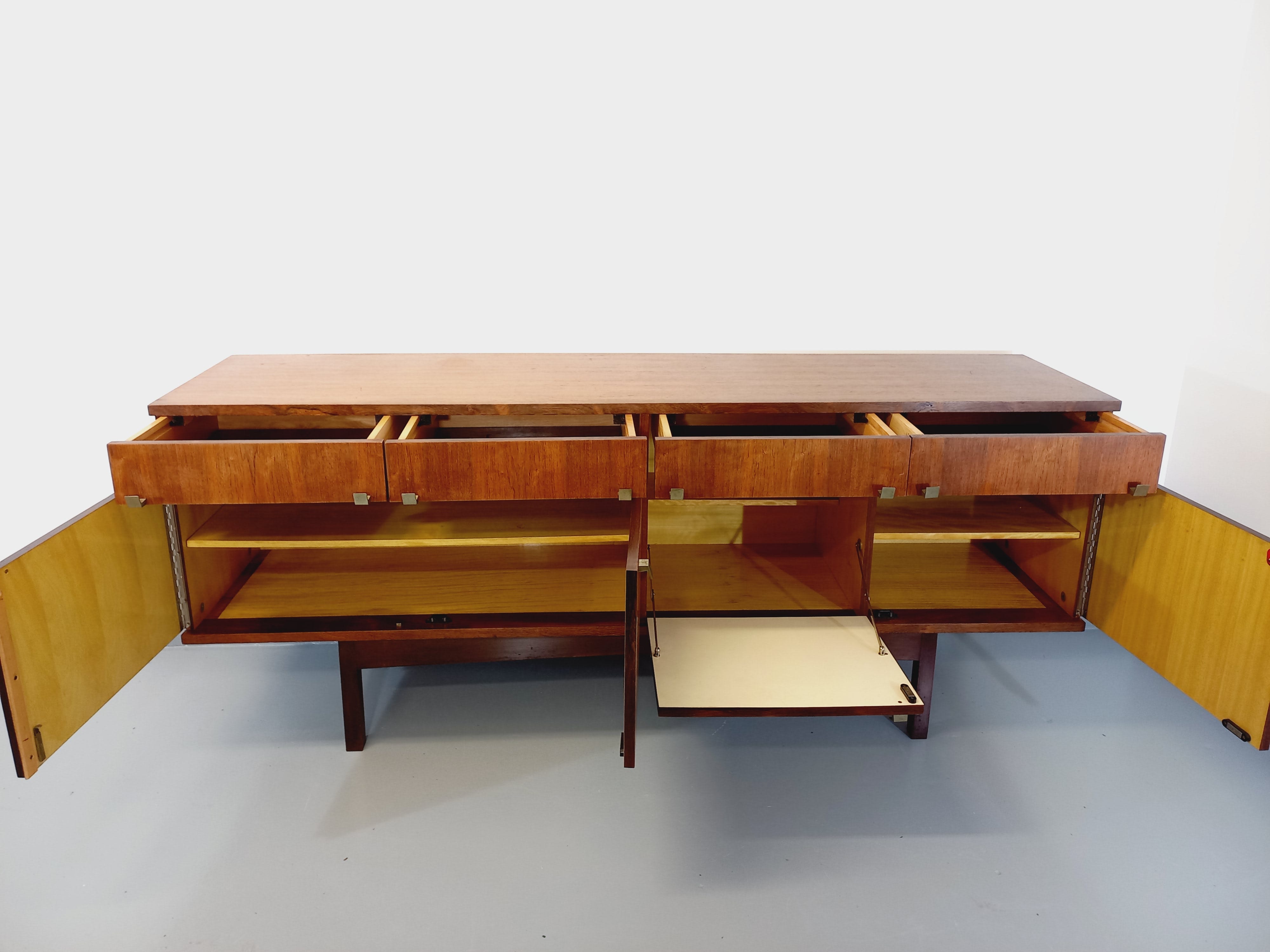 Vintage Scandinavian style row in rosewood and brass from the 60s