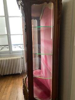 Large wooden display cabinet in Louis XV/rococo style with a strongly curved front.