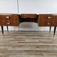 Mid-century drawer chest in mahogany, brass and glass.