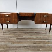 Mid-century drawer chest in mahogany, brass and glass.