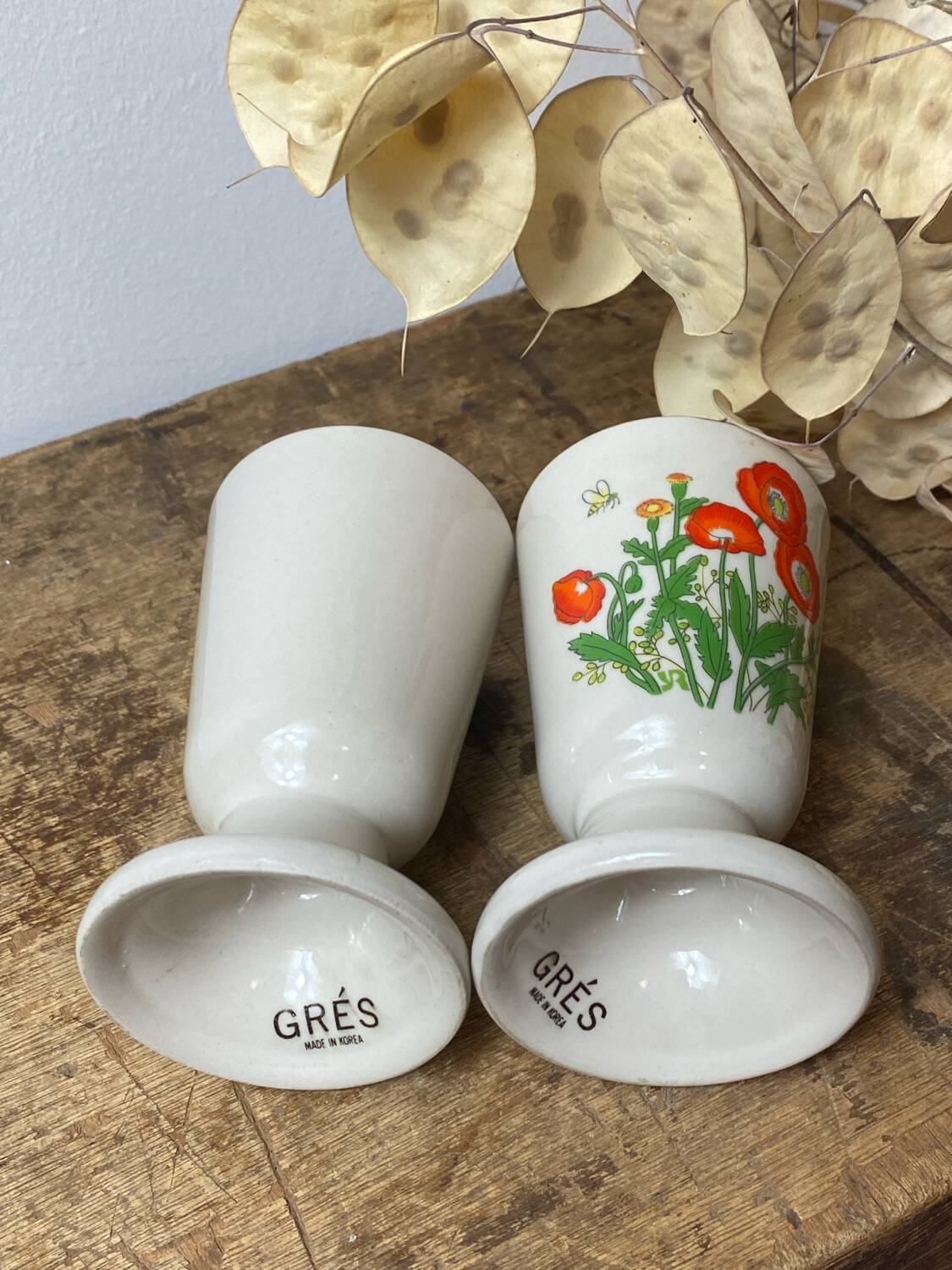 Pair of stoneware mazagrans, poppy decoration