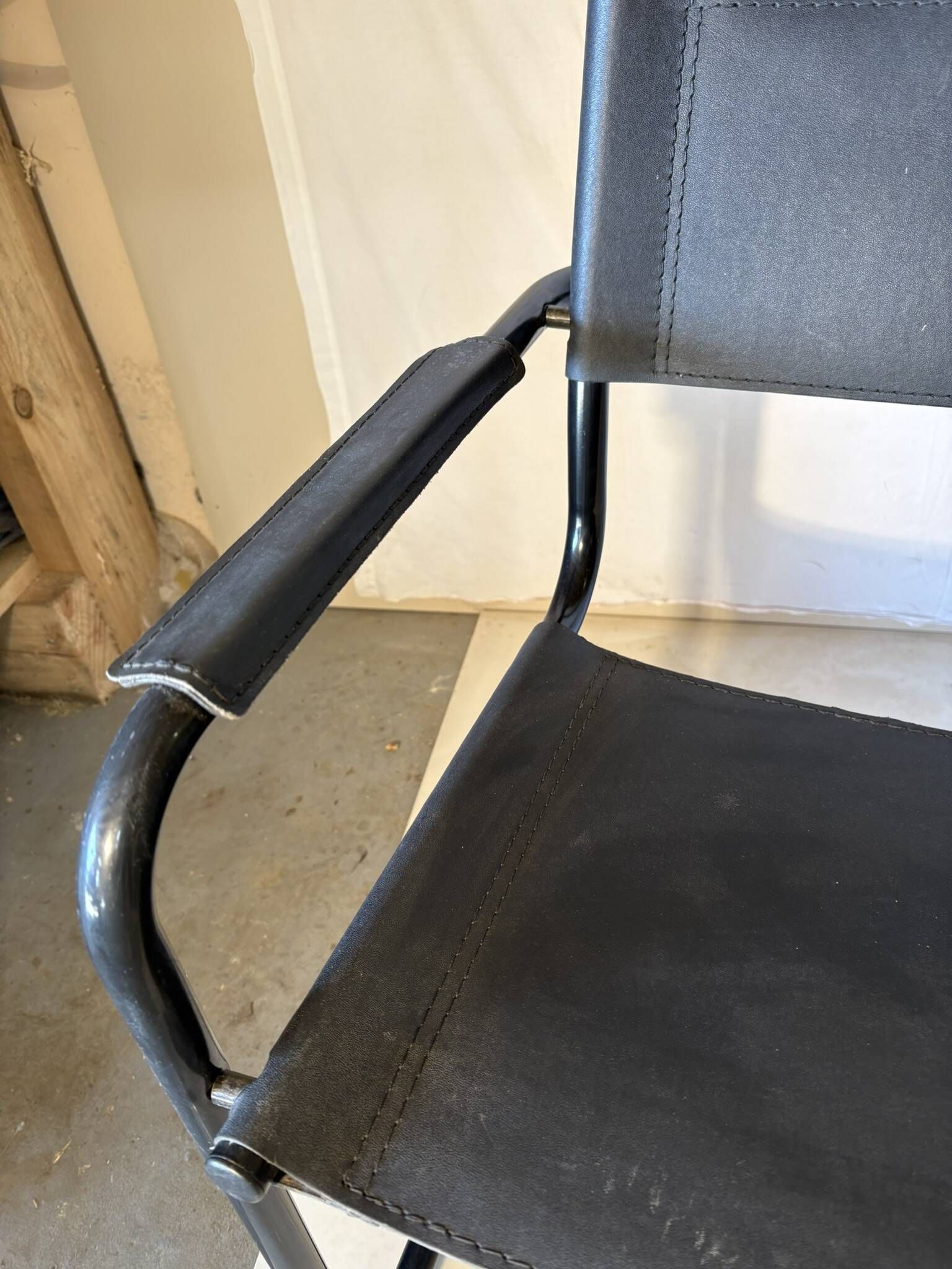 Set of 12 vintage black leather and tubular steel chairs – Italy, year