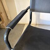 Set of 12 vintage chairs in black leather and tubular steel – Italy, 1970s