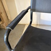Set of 12 vintage black leather and tubular steel chairs – Italy, year