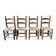 Set of 4 solid wood chairs with straw seats.