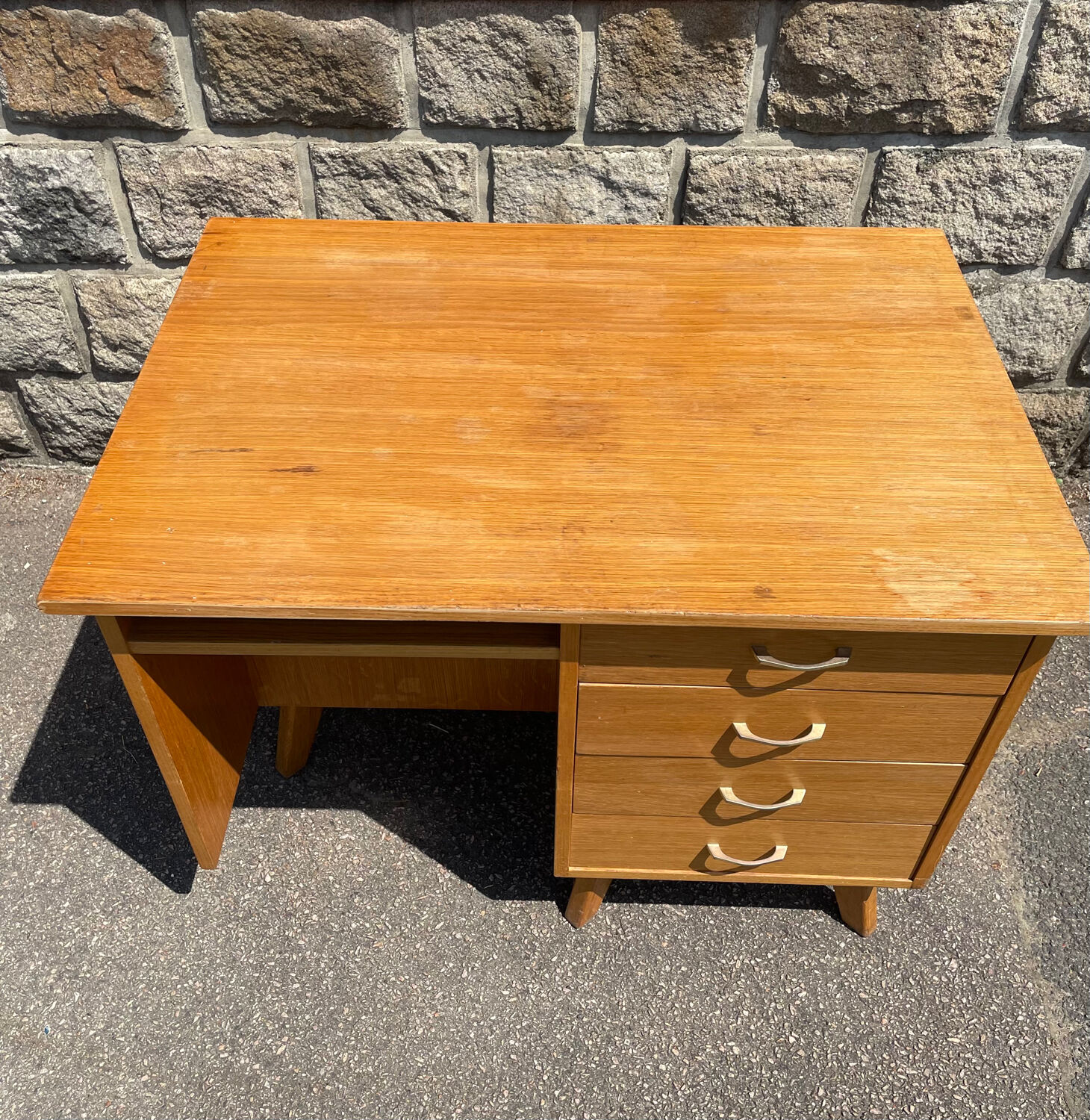 Double-sided desk with compass legs.