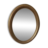 Oval mirror Glass Saint Gaubin framed in gold leaf.