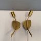 A set of "tulip" wall lamps in golden colored metal. Danish 1970-80s
