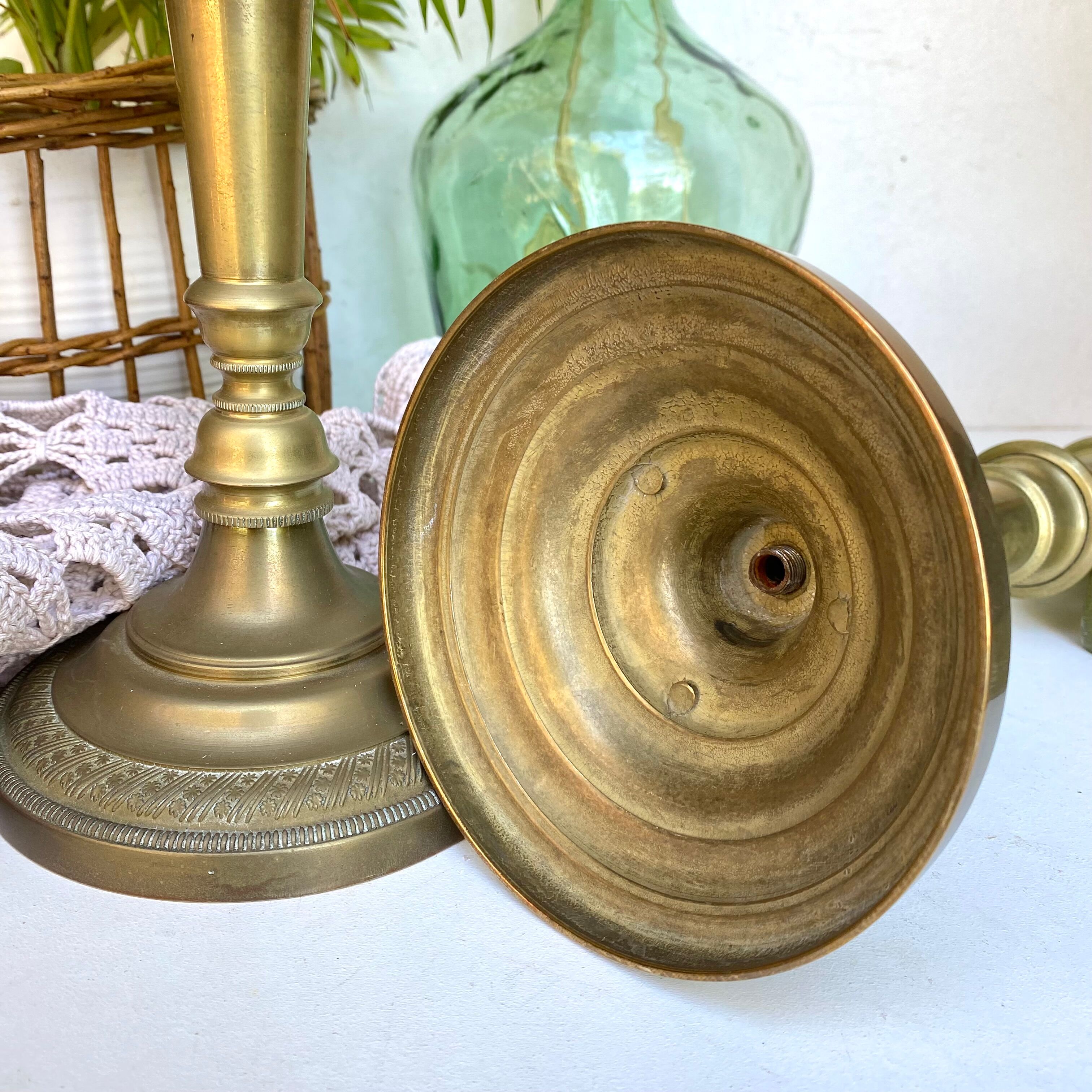 Pair of old candle holders in golden brass