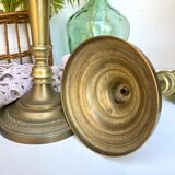 Pair of old candle holders in golden brass
