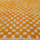 Yellow and white checkered Berber rug