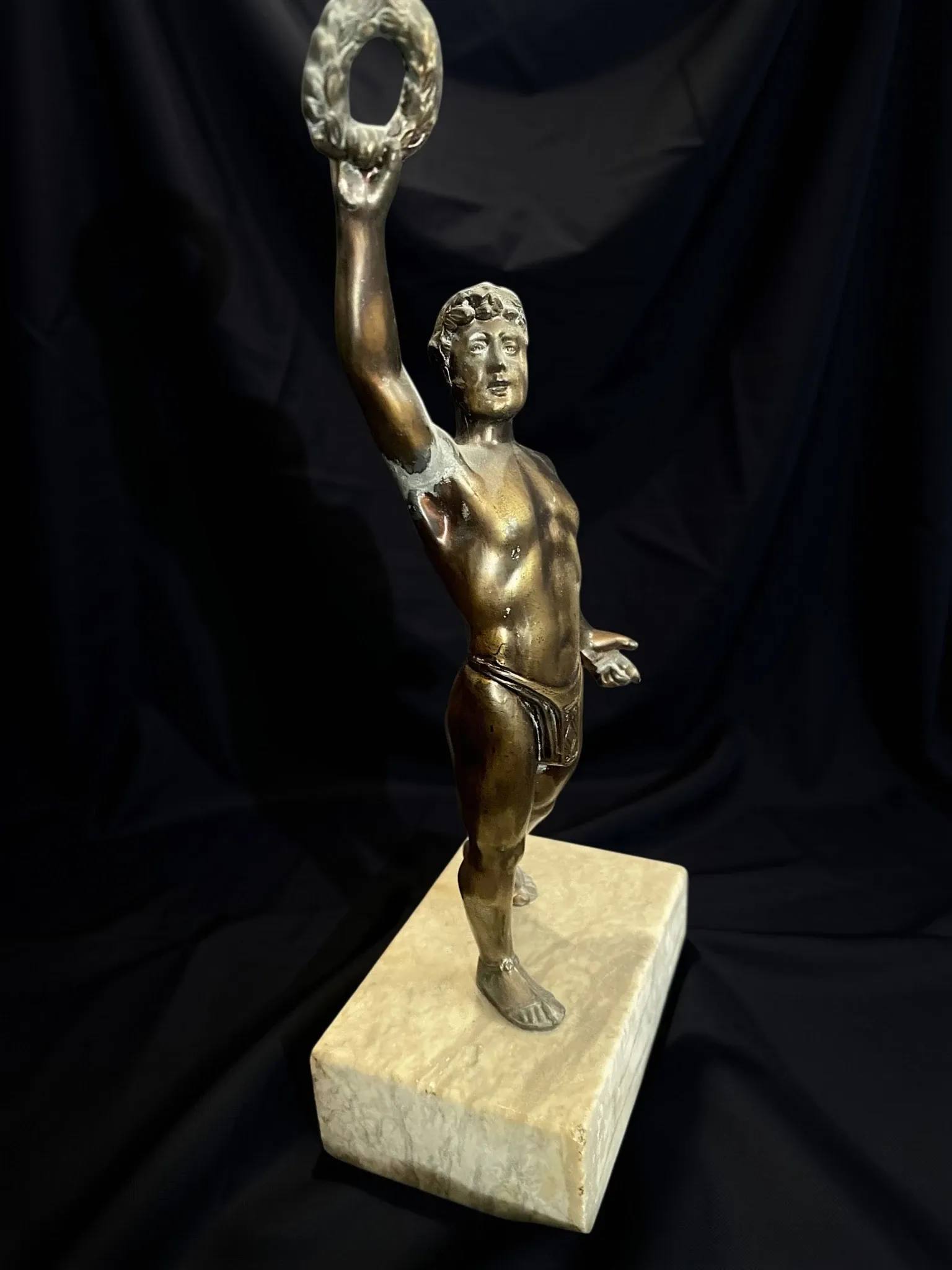 Antique bronze sculpture on a marble base, Roaring Twenties, around 1930.