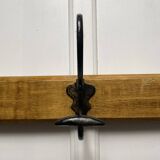 Antique wooden coat rack with metal hooks