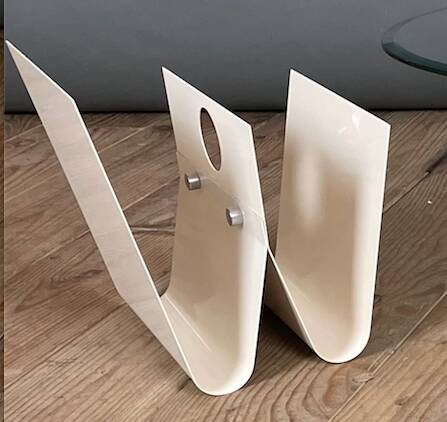 White lacquered metal magazine rack from the 1970s