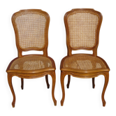 Pair of wooden and caned chairs in Louis XV style.