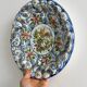 Hand painted decorative dish with floral motifs