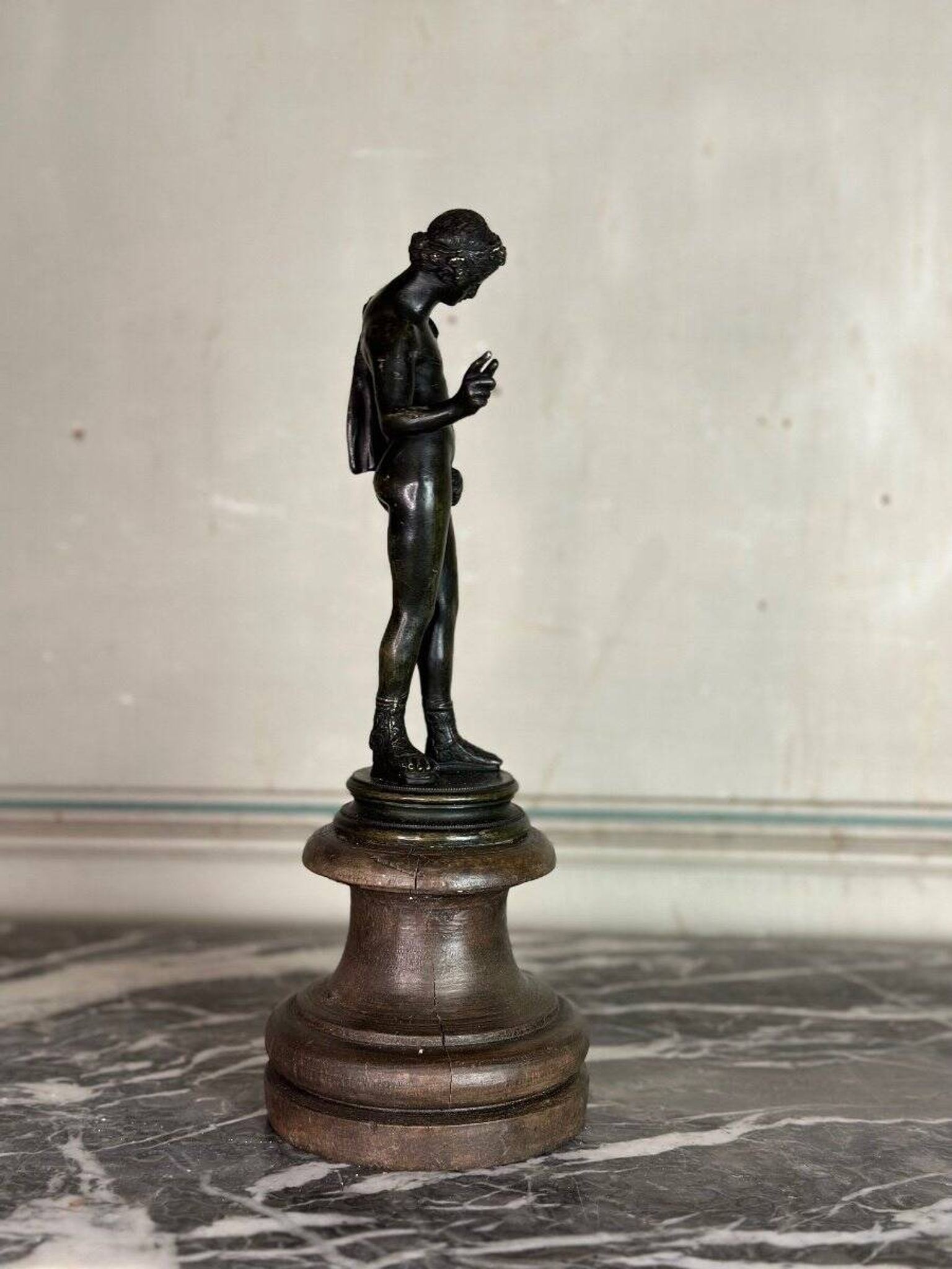 Narcissus, bronze after the antique on a wooden base, circa 1880.