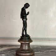 Narcissus, bronze after the antique on a wooden base, circa 1880.