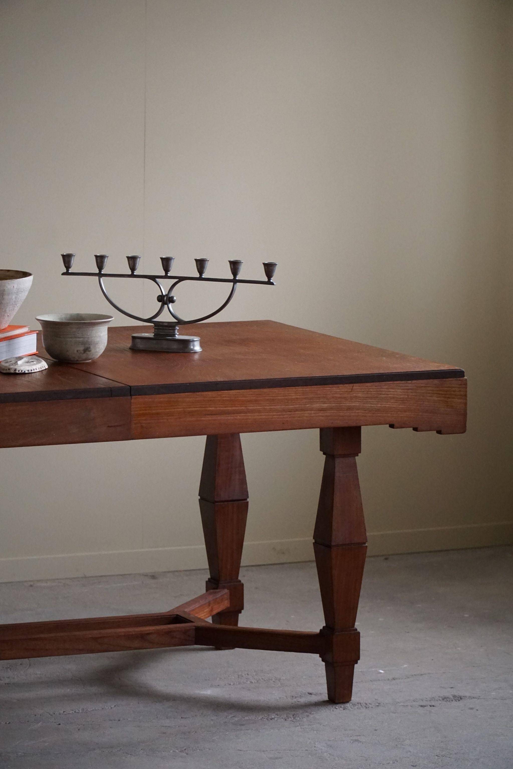 Art Deco dining table in teak, with butterfly extension, Danish cabinetmaker, 1940s.