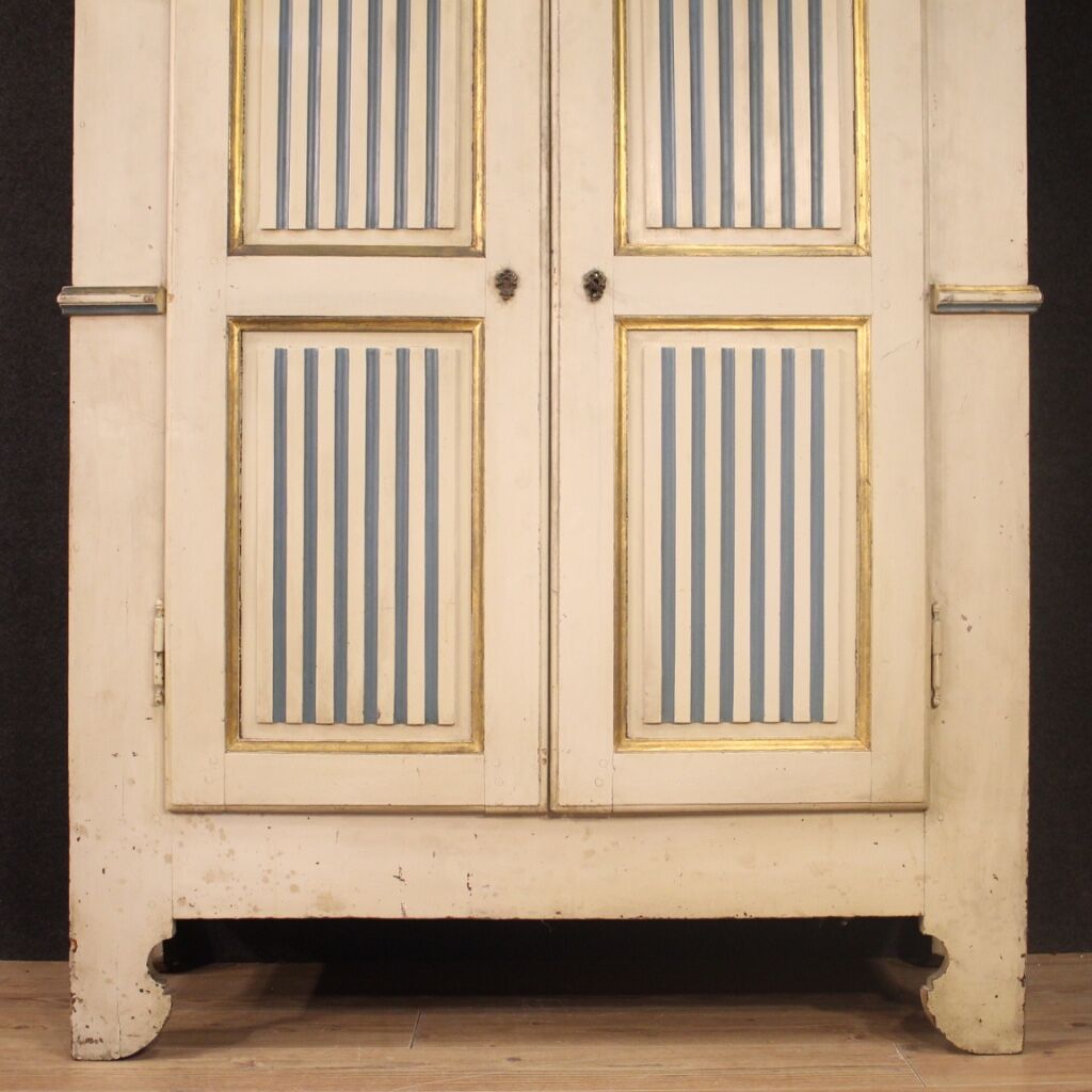 Antique lacquered and gilded Italian wardrobe in Louis XVI style from 19th century