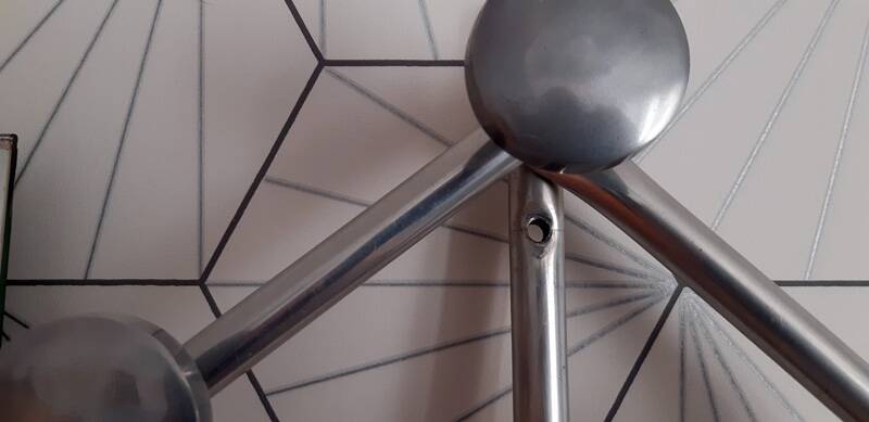 Vintage aluminum wall coat rack.