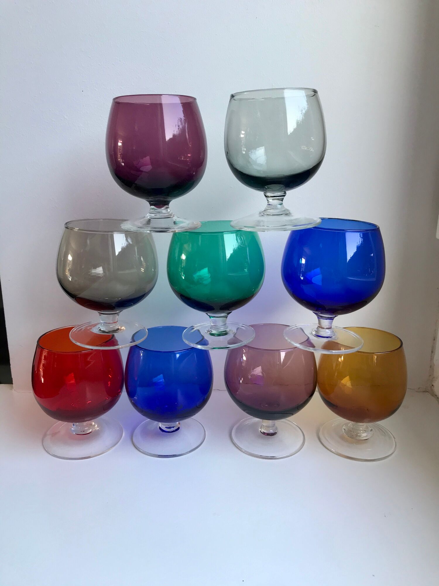 Set of 9 glasses with colored feet in blown glass 50s