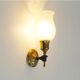 Paire de lampes murales 'torche' dans le style de Maison Jansen