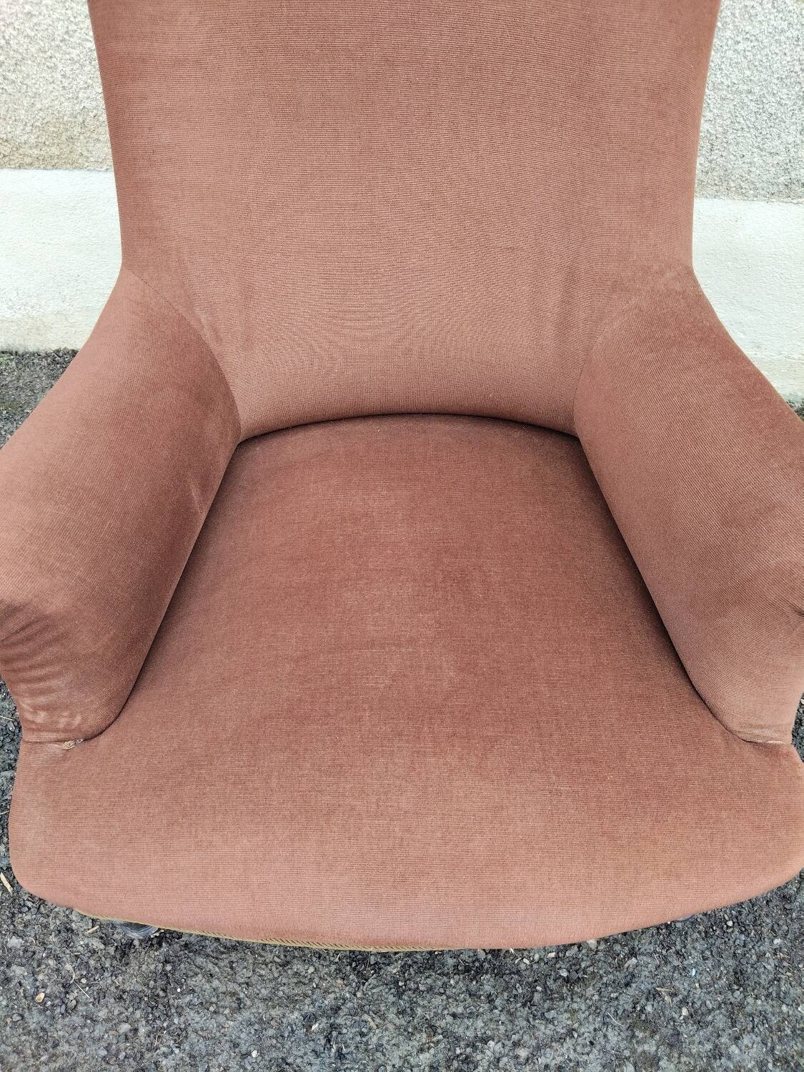 Antique brown velvet tub chair – turned legs and brass rings.