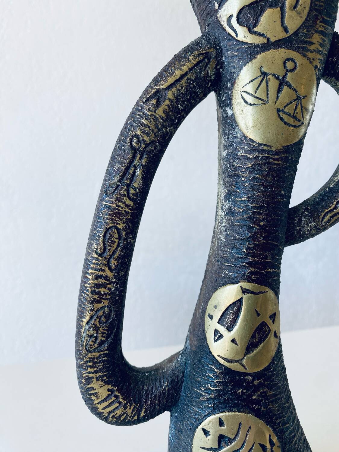 Brutalist bronze vase, the signs of the zodiac