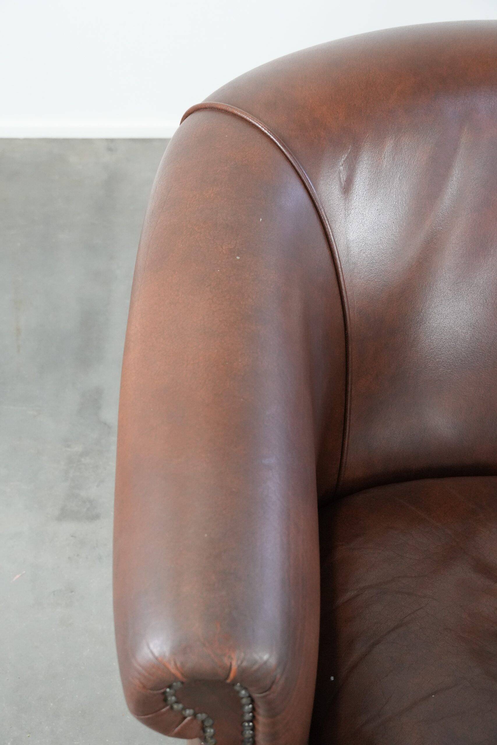 Unique set of two cognac-coloured cow leather club armchairs
