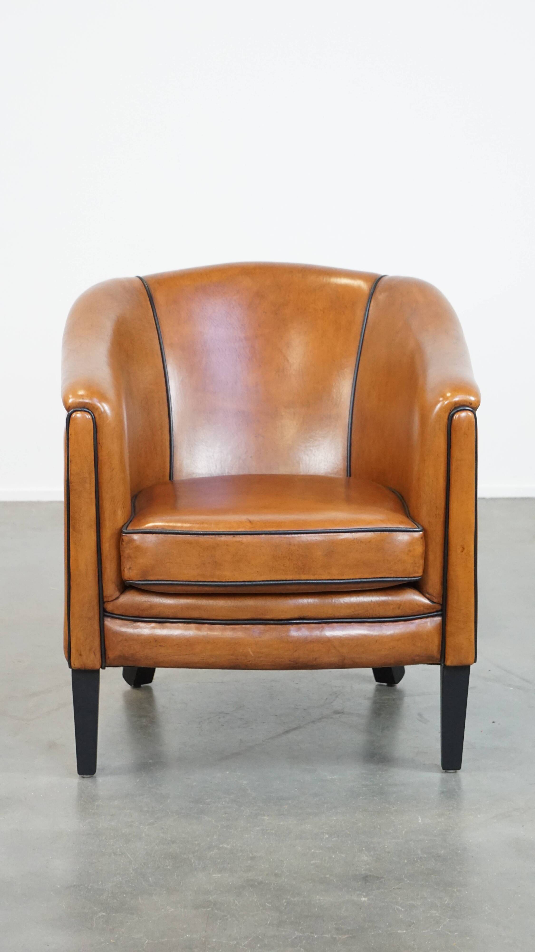 Sheep leather club chair finished with black piping