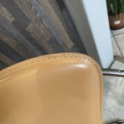 1 Linda armchair chair by Arrben in camel brown leather with a chrome steel frame.
