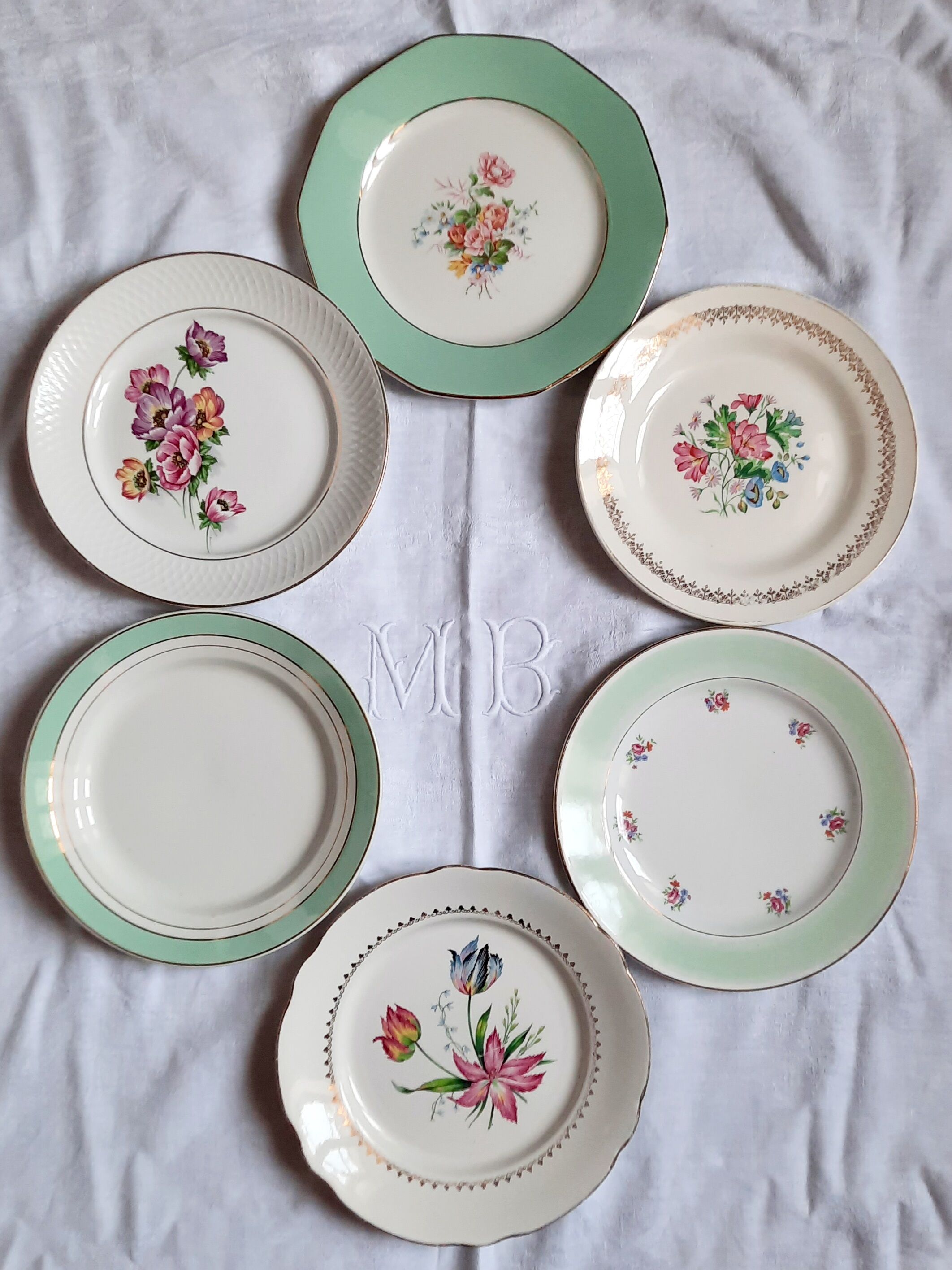 Flat antique earthenware plates with gilded edges