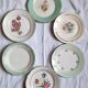Flat antique earthenware plates with gilded edges