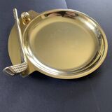 Round brass pocket tray with club and golf ball decoration.