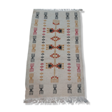 White kilim carpet with multicolored Berber patterns