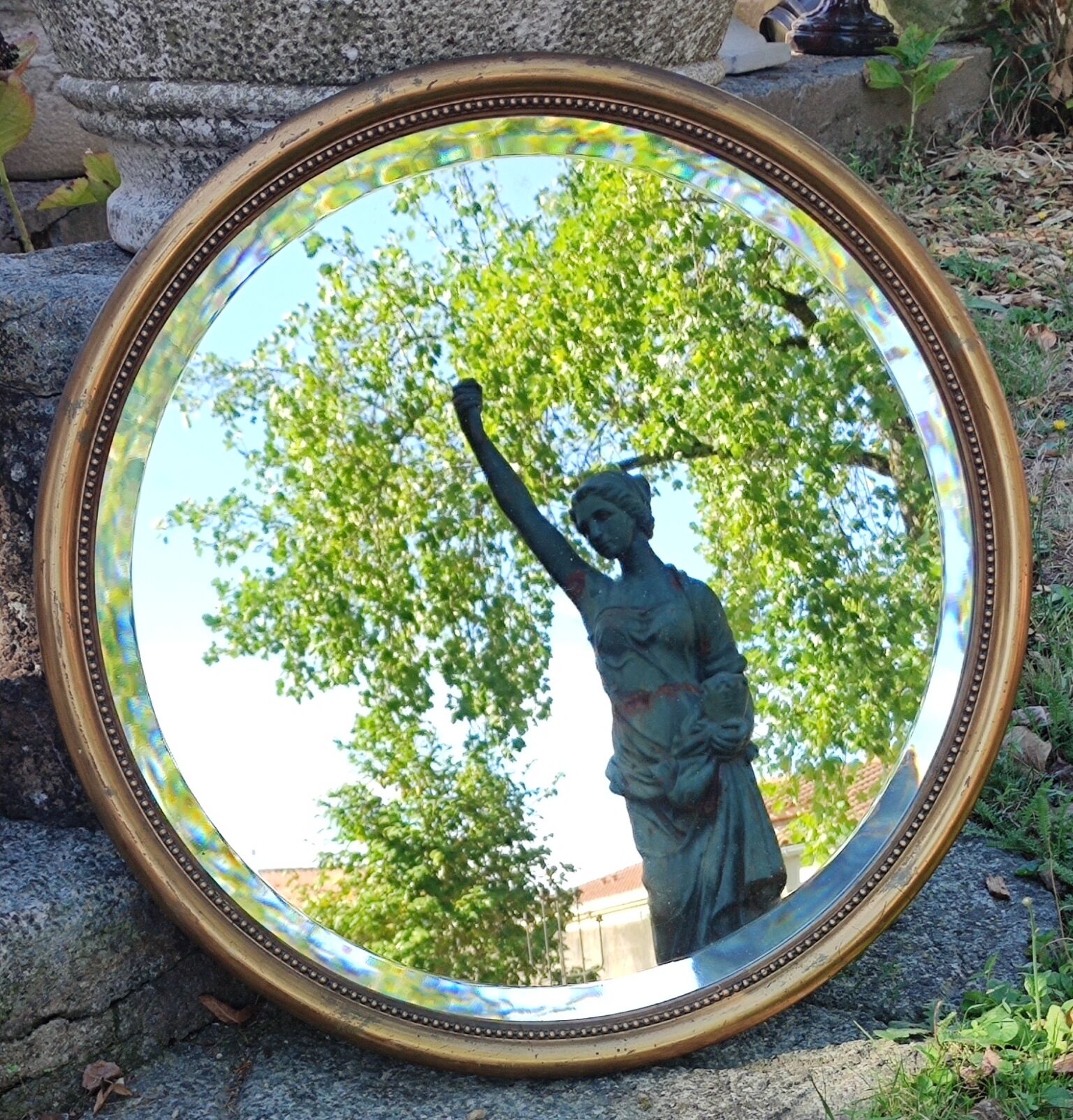 Old beveled round mirror